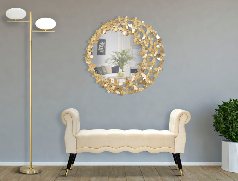 Miroir mural rond en métal doré avec papillons volants