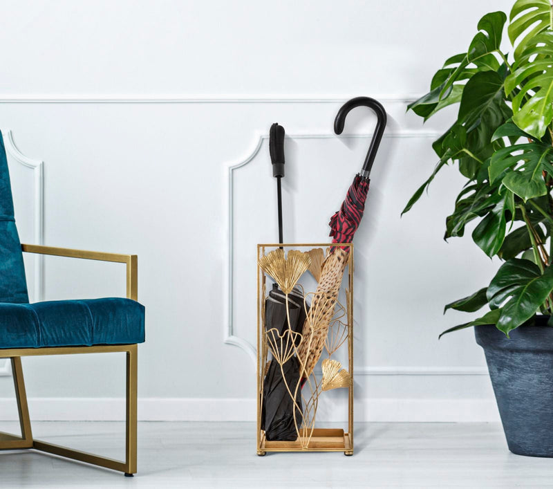 Porte-parapluie en métal doré avec décor de feuilles