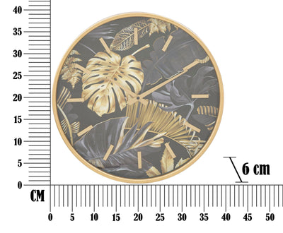 Horloge murale dorée et grise avec feuilles tropicales