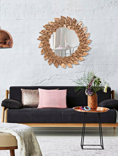 Miroir mural rond avec feuilles en métal doré