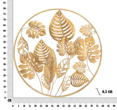 Décoration murale en feuilles tropicales dorées dans un cadre rond