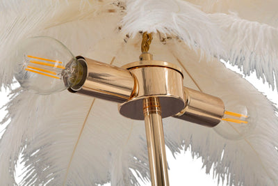 Lampe à poser en métal doré et plumes blanches