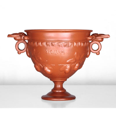 Tasse à vin romain avec reliefs de glands et manche - céramique sigillée