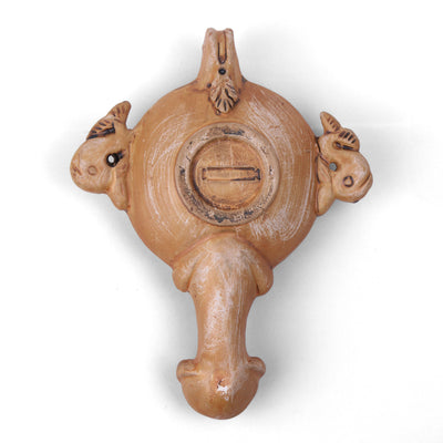 Lampe à huile ancienne avec un relief d'Éros - céramique romaine
